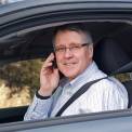 Portrait of Man Sitting in Car Talking on Cell Phone