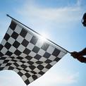 man waving checkered flag