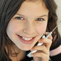 Tween talking on a cell phone