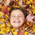 girl lying in leaves
