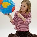 young girl holding globe in her hand