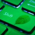 Green Computer keyboard with leaf on key