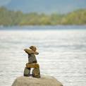 Inukshuk on a rock in the ocean