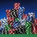 stacks of colored poker chips on green felt