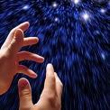 hands reaching for shining stars in a starry sky