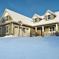 house during winter with fresh snowfall