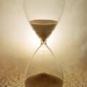 Sands of time through hourglass