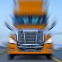 truck driving on road with motion blur
