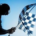 man waving checkered flag