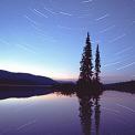 star trails over lake