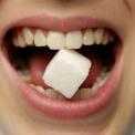 Sugar Cube between Teeth