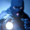 thief with flashlight