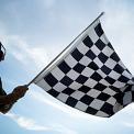 man waving checkered flag