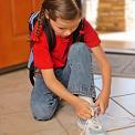girl tying shoelaces